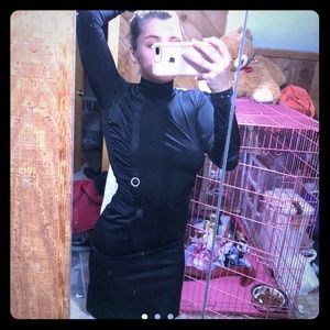 Black tight dress, zipper on side.